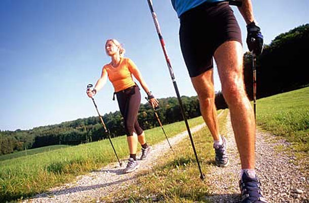 male and female nordic walkers