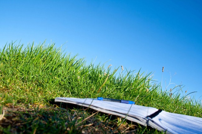 Notebook on grass to illustrate writing to heal, the healing power of writing