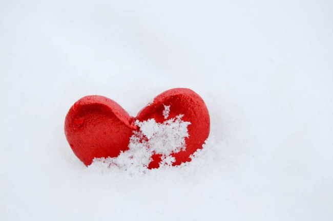 Red heart on snow to represent how the menopause almost destroyed my relationship.