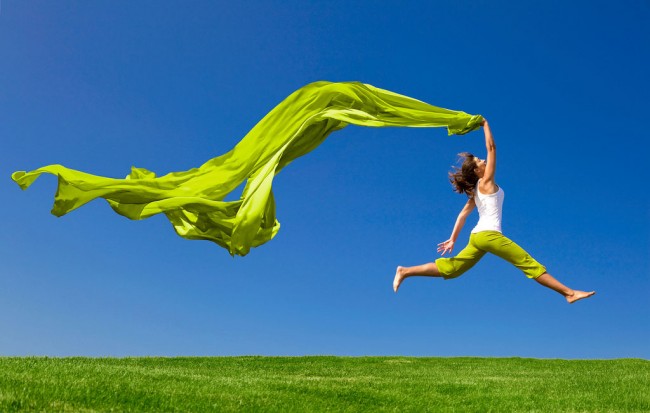 Woman jumping for joy to illustrate how Rolfing changed my life