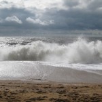 waves crashing onto shingle beach